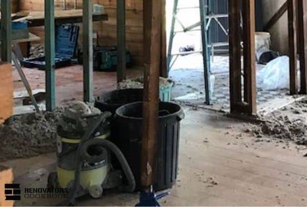 Using heavy duty industrial wet and dry vacuum cleaner on the worksite at West End job