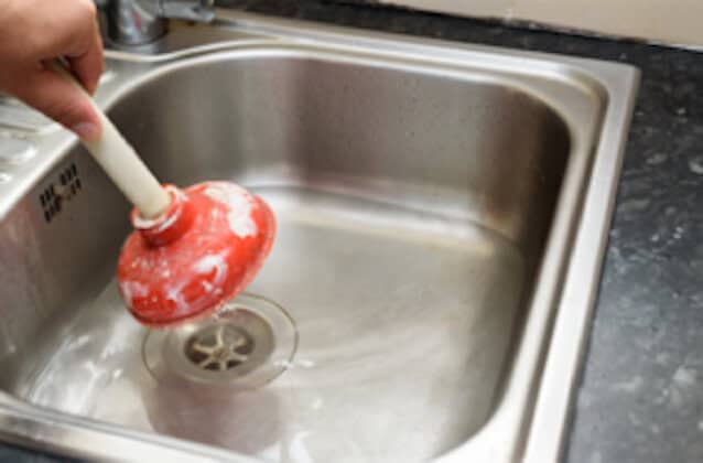 using a plunger to unclog a kitchen sink