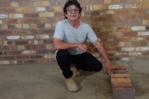 Marty demonstrating different brick types for DIY bricklaying course